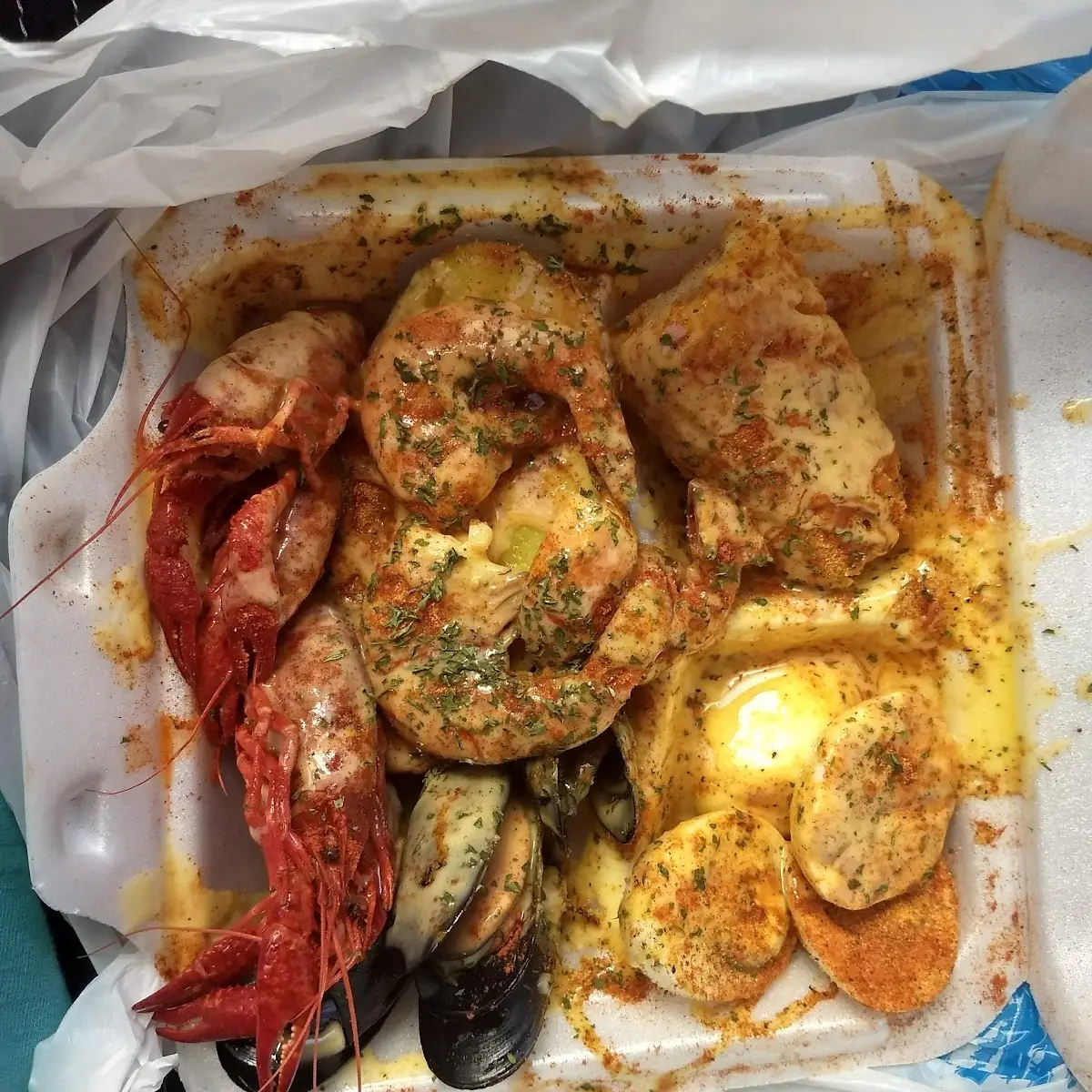 Crawfish Shrimp Mussel's Boiled Egg Corn Cobb with Butter and Seasoning on Top of Everything