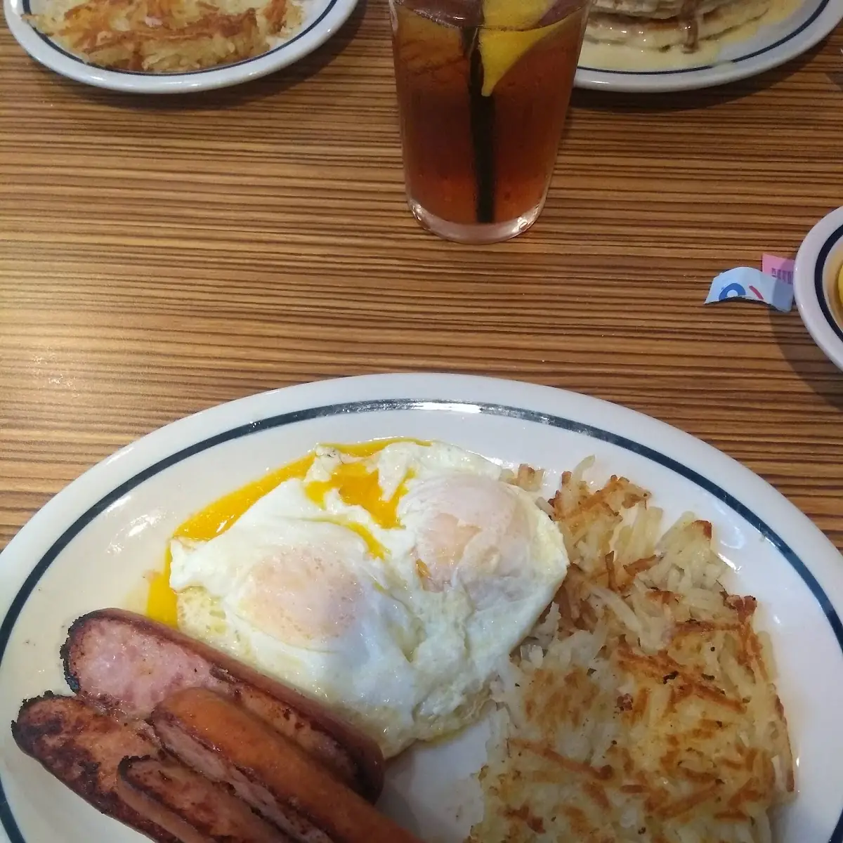 Dos Leches Pancakes with Hash Browns Bacon and Scrambled Eggs with Cheese