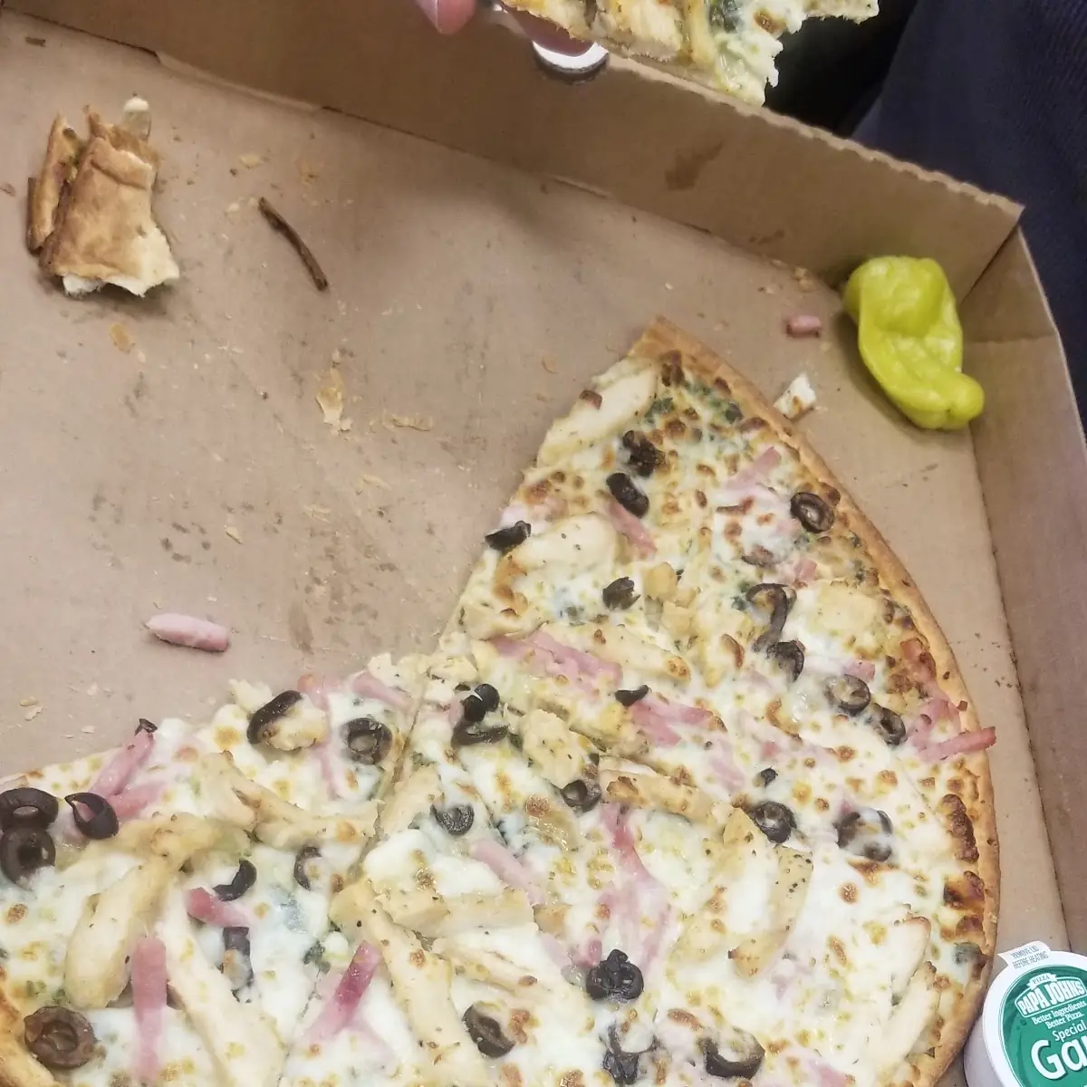 Thin Crust Spinach Alfredo Sauce Onions Chicken and Black Olives Pizza