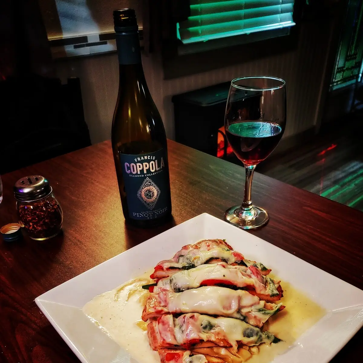 Chicken Parm over Roasted Red Peppers and Spinach over Linguini