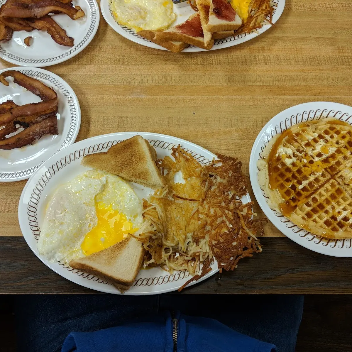 All-Star Breakfast with Bacon Eggs over Medium and Hash Browns