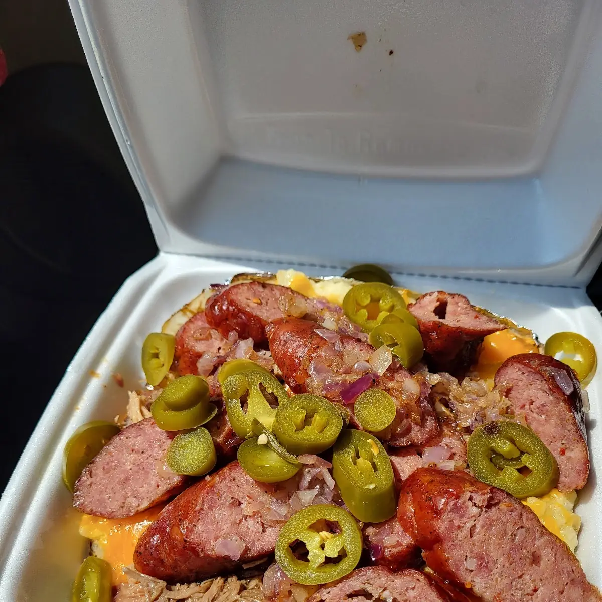 Loaded Baked Potato w Sausage Pulled Pork Jalapeños and Grilled Onions