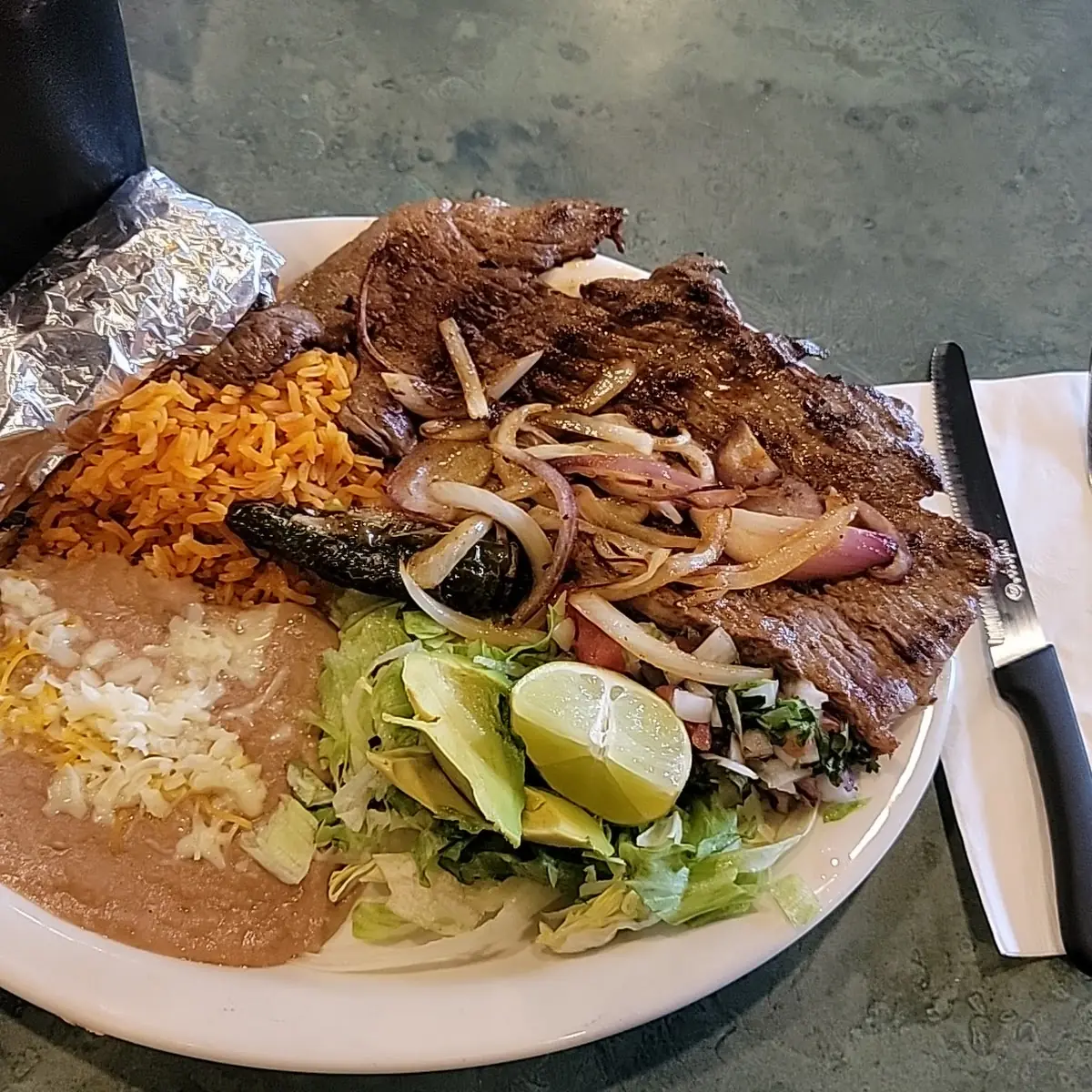 Carne Asada with Onion and Refried Beans