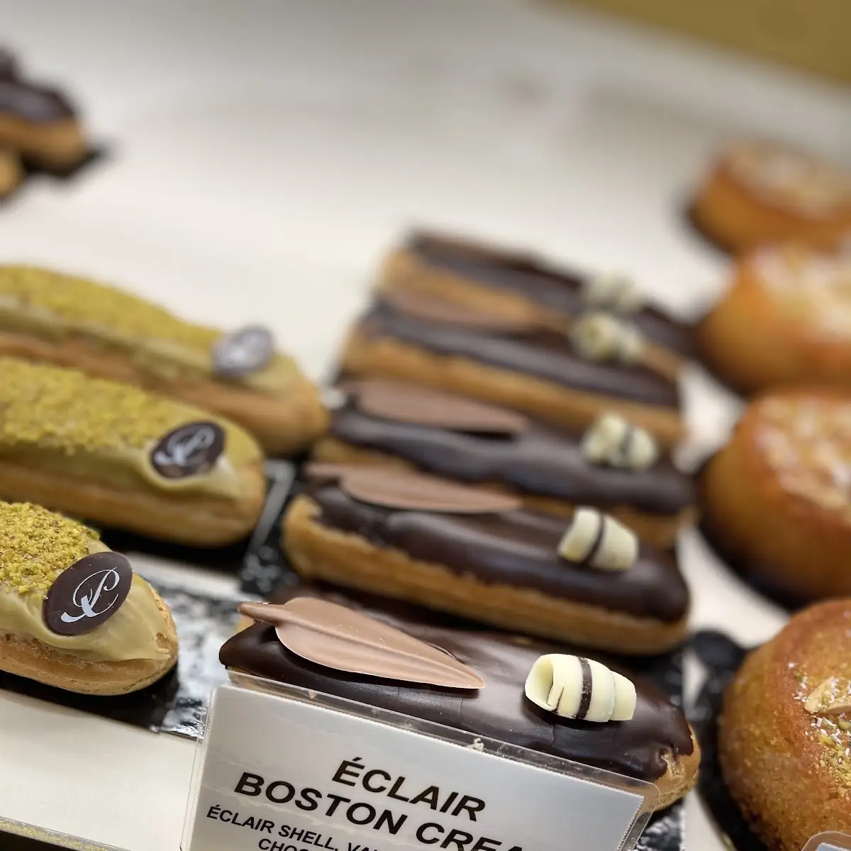 Chocolate Eclair and Pistachio Eclair