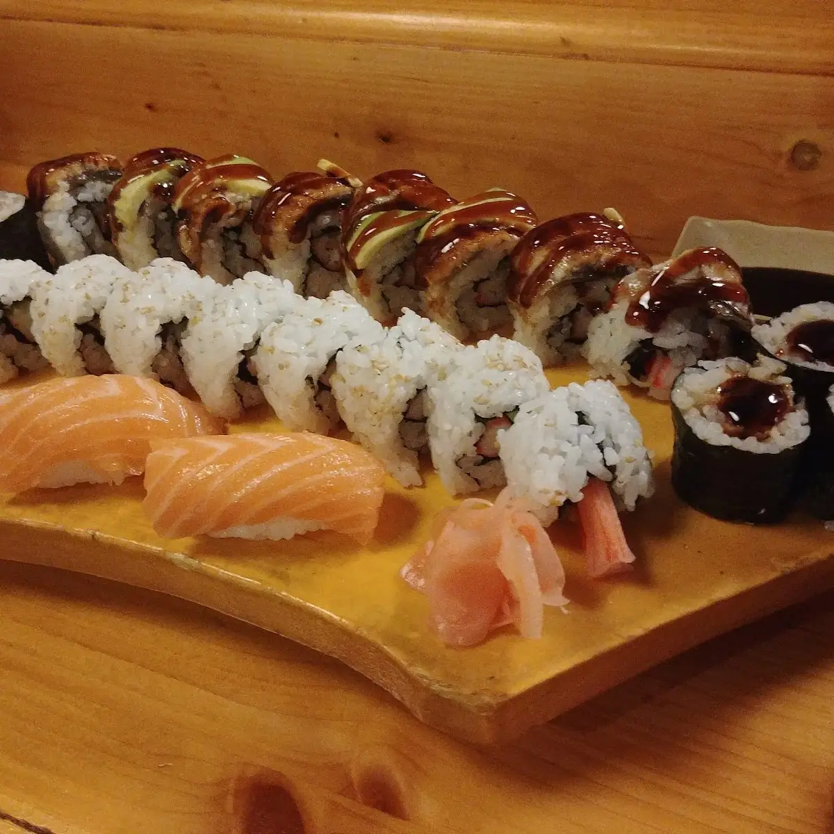Dragon Roll Back Center Eel Roll Back Sides California Roll Middle Salmon Nigiri Front