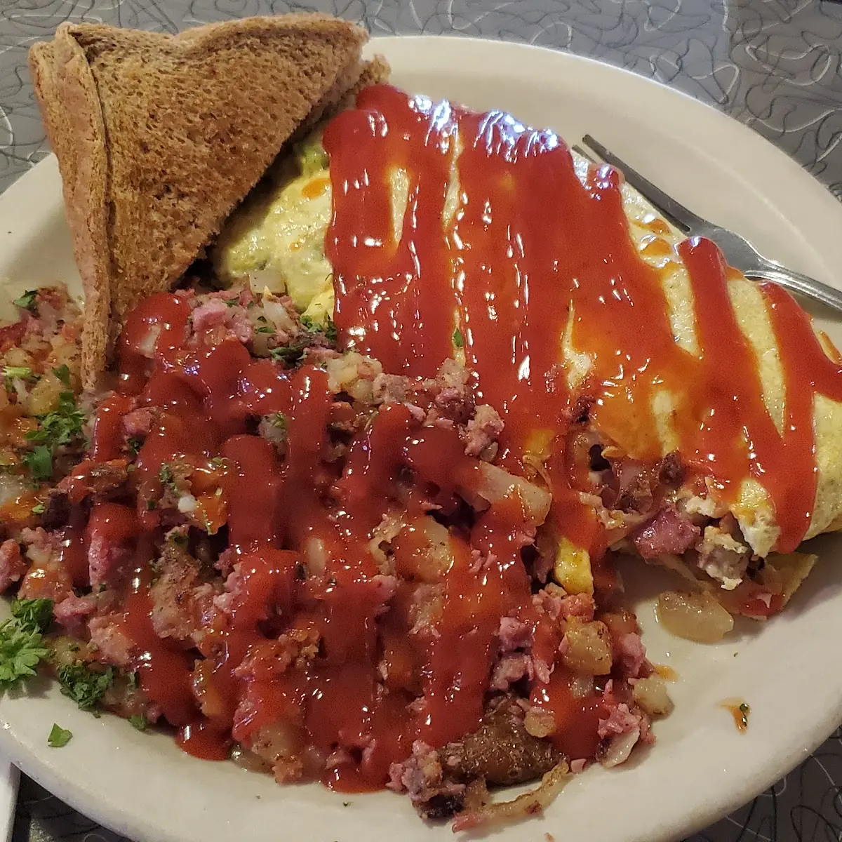 Corned Beef Hash and Meat Lovers Omelette