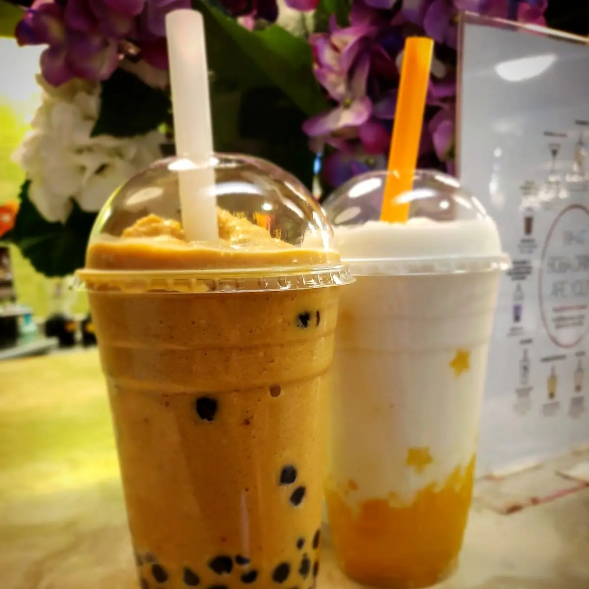 Thai Tea Slushie with Extra Boba & Lychee Slushie with Mango Stars