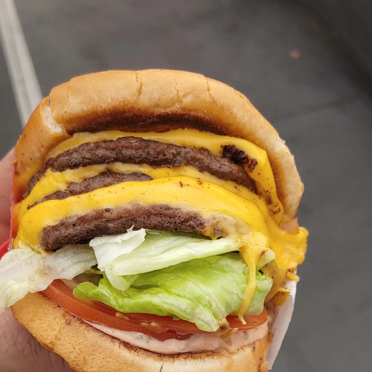 Triple Cheeseburger with Grilled Onions