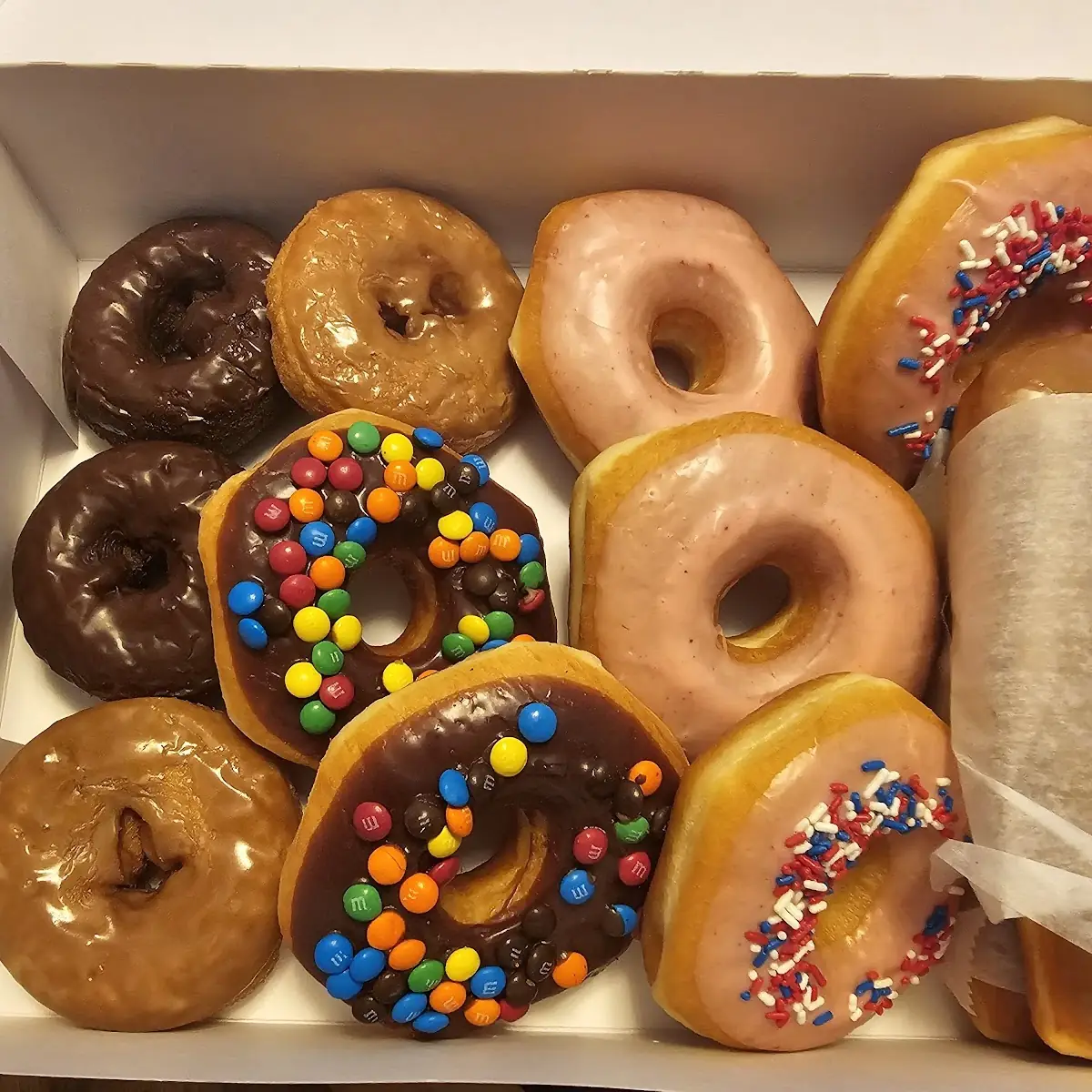 Assorted Glazed and Sprinkled Donuts