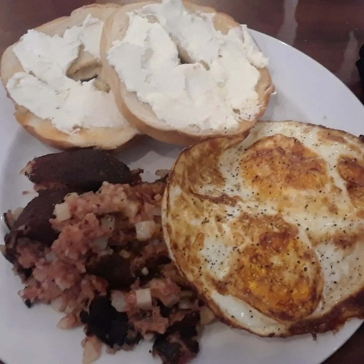 Two Eggs Any Style Toasted Bagel with Cream Cheese Corned Beef Hash