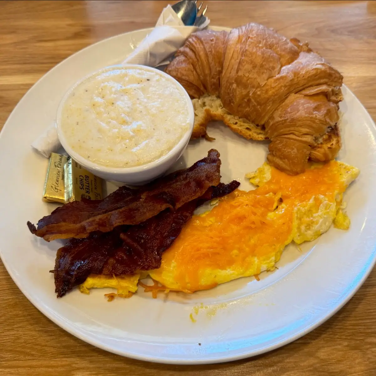 Bacon Eggs Grits and Croissant