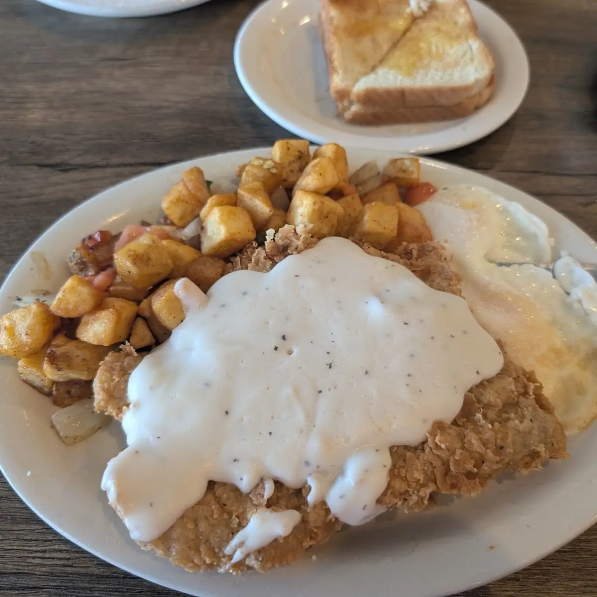 Chicken Fried Steak & Eggs Any Style with Hash Browns and Huge Biscuit
