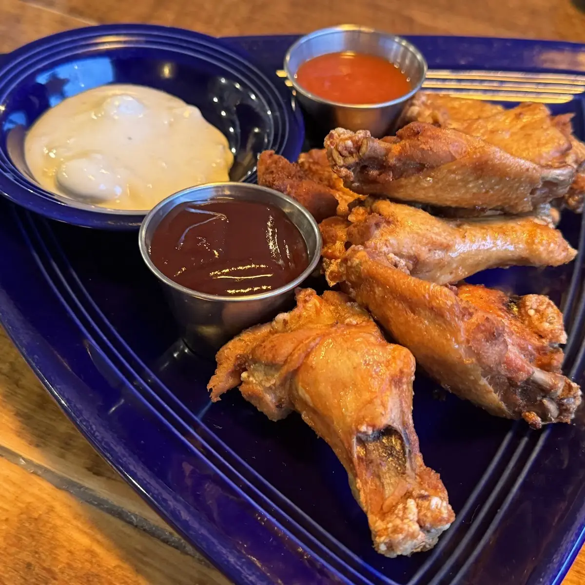 Buffalo Wings Sauce on a Size with Extra Sauce Blue Cheese and More