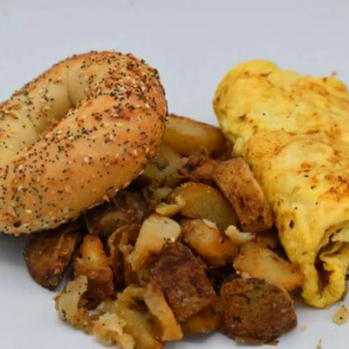 Scrambled Eggs on Bagel with Baked Potatoes