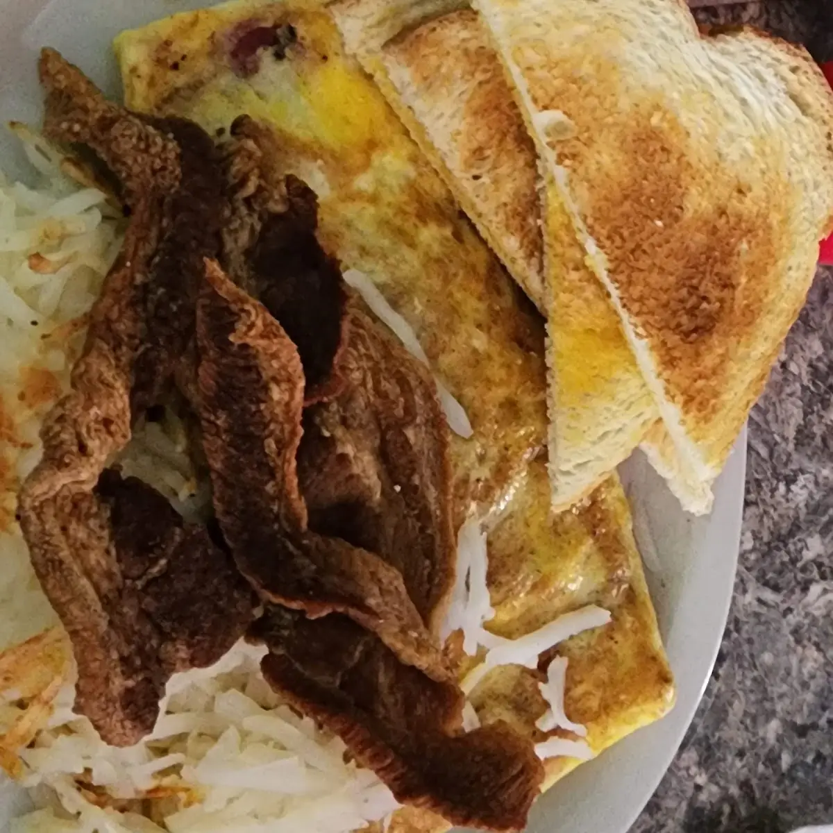 Meat Lovers Omelette with Hashbrowns and Side Pork