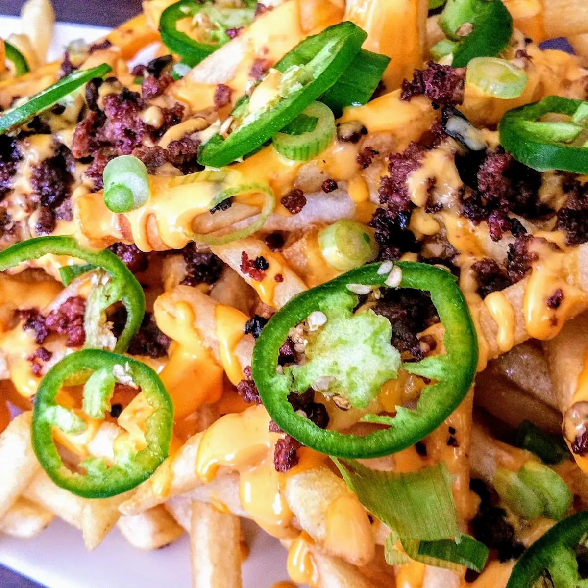 Loaded Kogi Fries with Sriracha Cheese Sauce