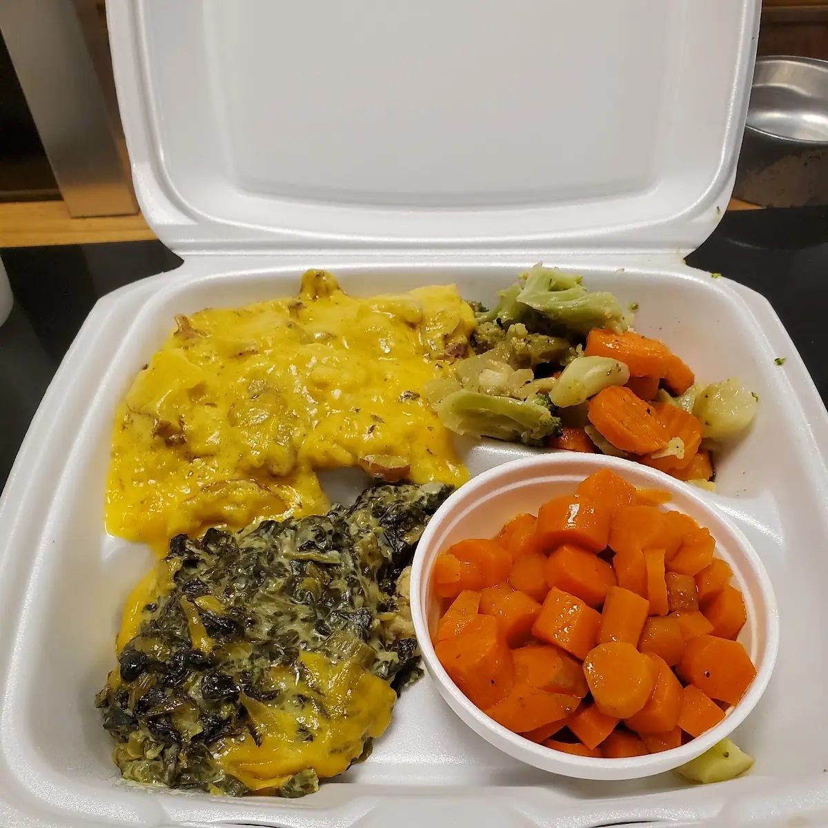 Augratin Potatoes Spinach Souffle Mixed Veggies Carrots