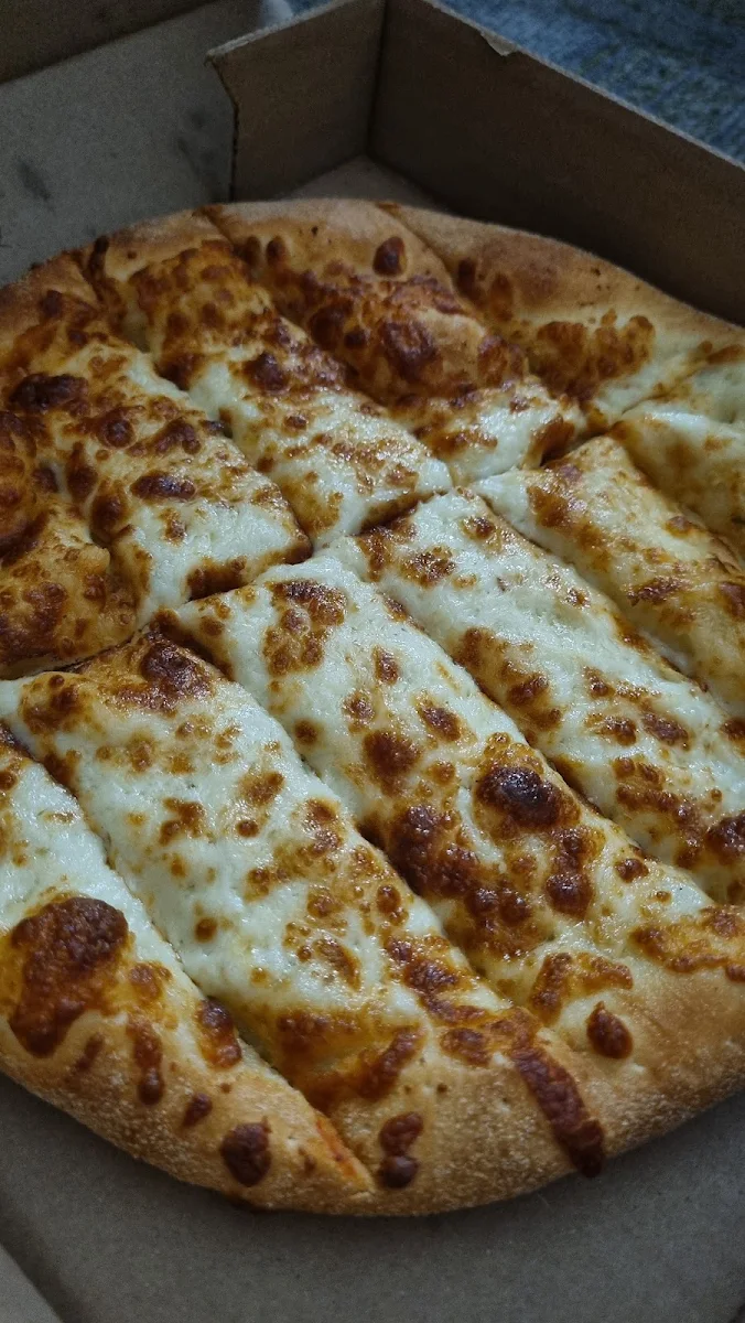 - 15 Pizzas & 12 Garlic Fingers, Gisele's Pizzeria Southside