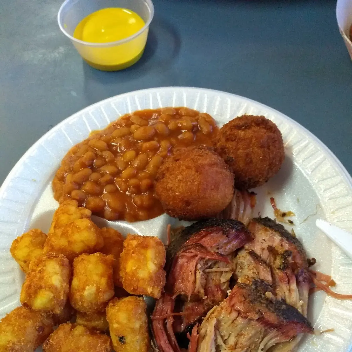 Small Pulled BBQ Plate with Baked Beans and Tater Tots and Roll with Hush Puppies