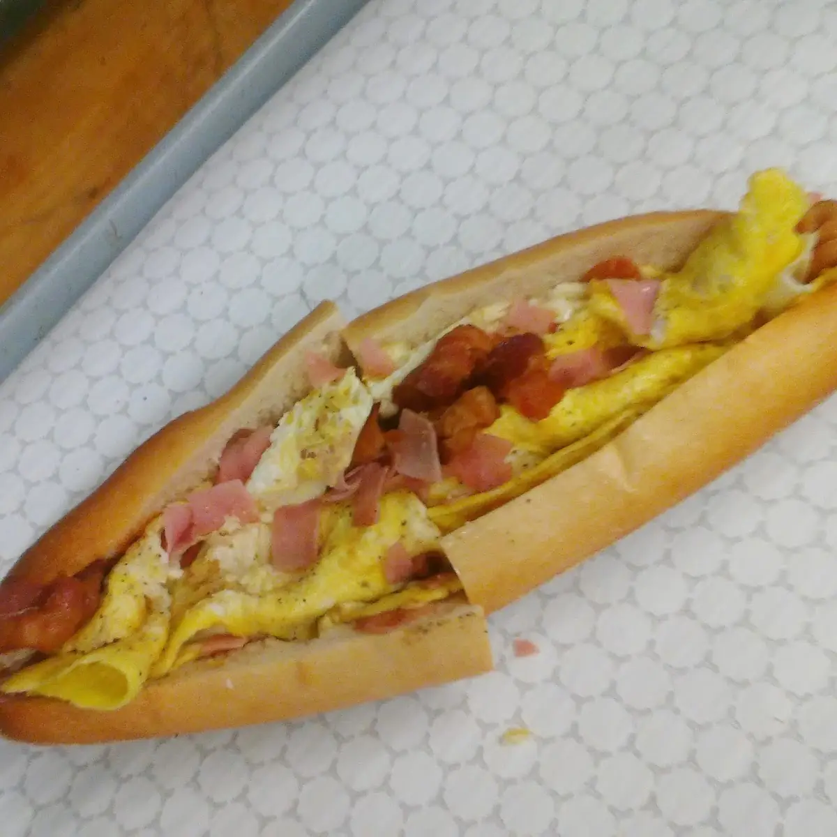 Scrambled Eggs Cheese Bacon and Ham Sandwich