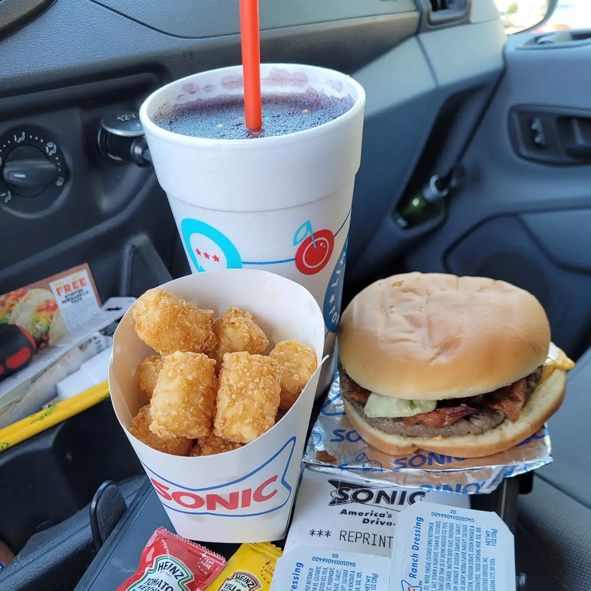 1 Sonic Cheese Burger with Bacon Cheeseburger Tots and Grape Slush