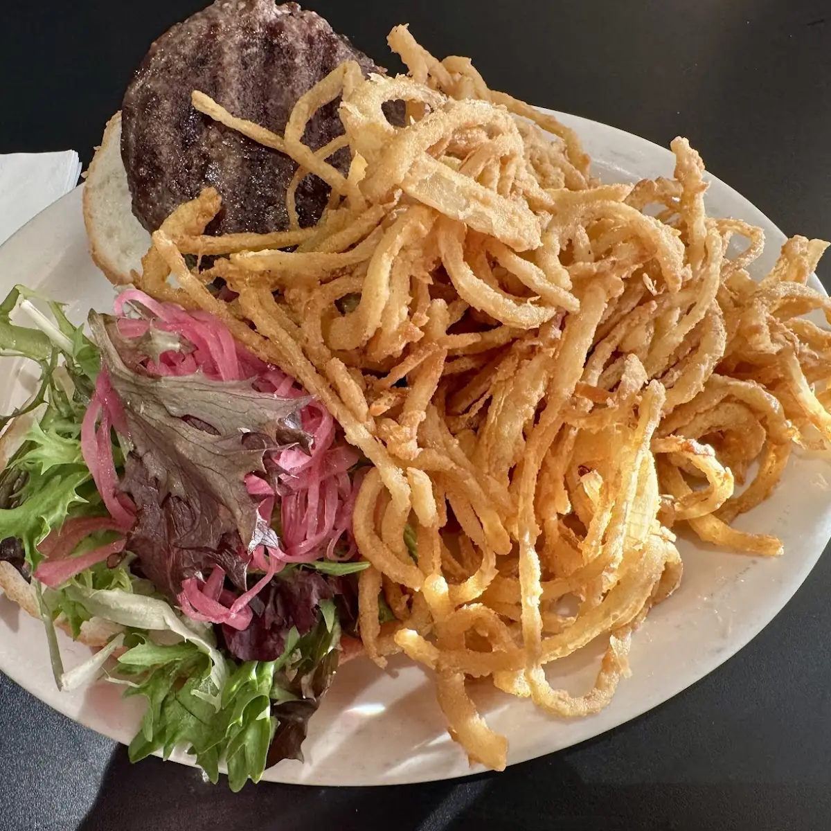 Cheddar Bacon Burger with Half Onion Strings and Half Fries