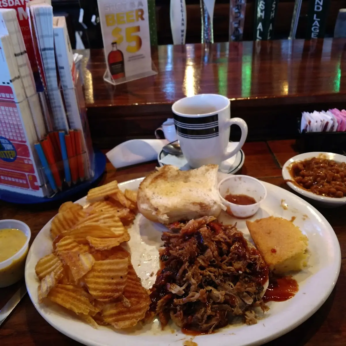 Pulled Pork Sandwich Macaroni Cheese Baked Beans and Waffle Fries