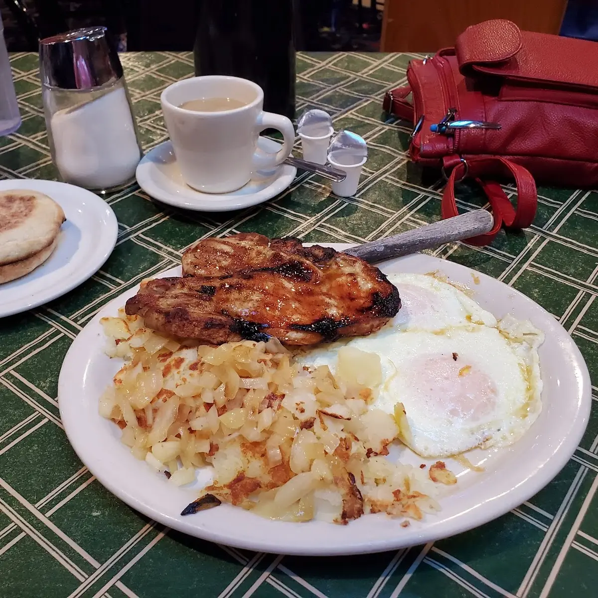 2 Eggs over Easy with a Grilled Pork Chop Hash Browns with Grilled Onions