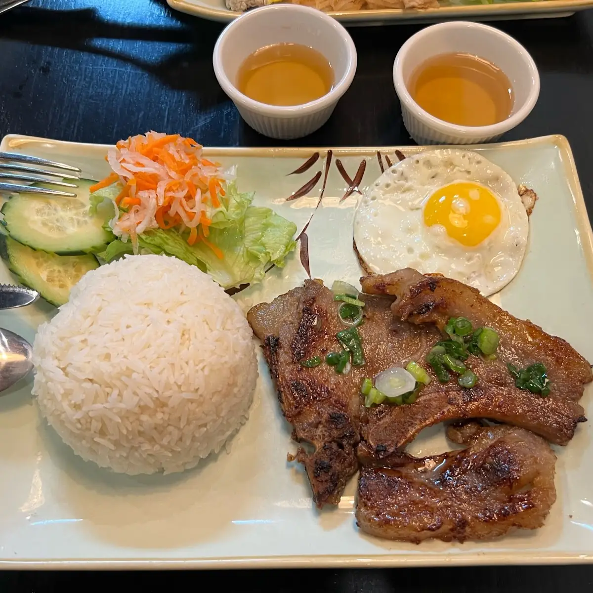 Broken Rice with Grilled Pork Chops and Eggs Benedict