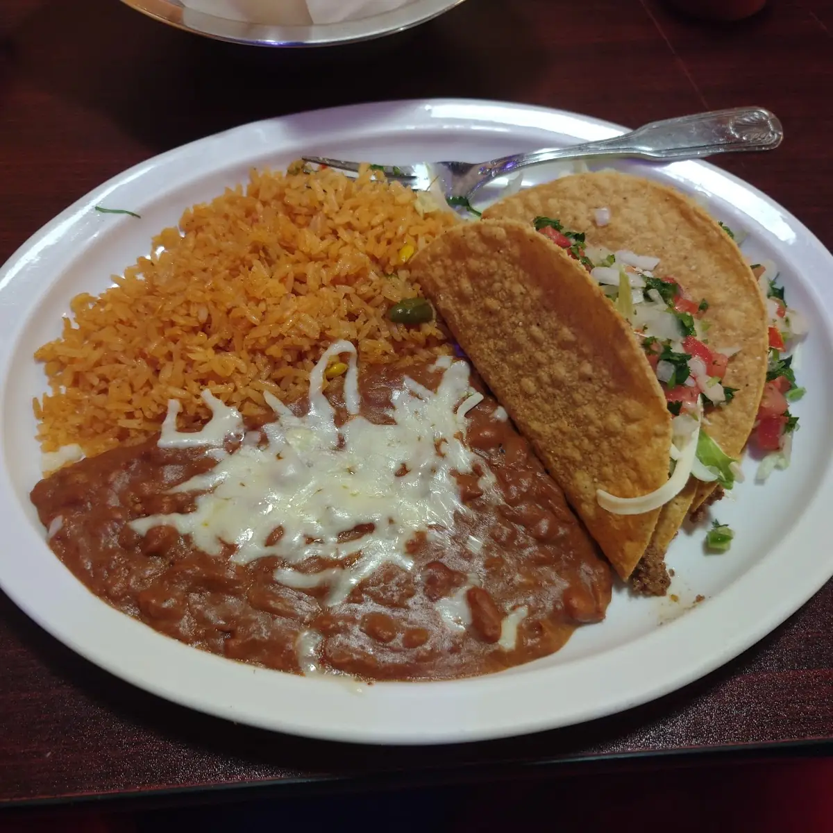 Two Enchiladas Rice & Beans