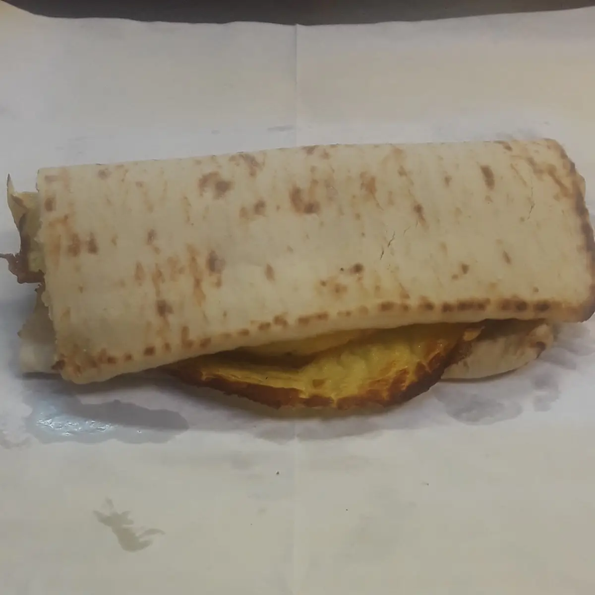 Bacon and Egg Sandwich on White Flatbread