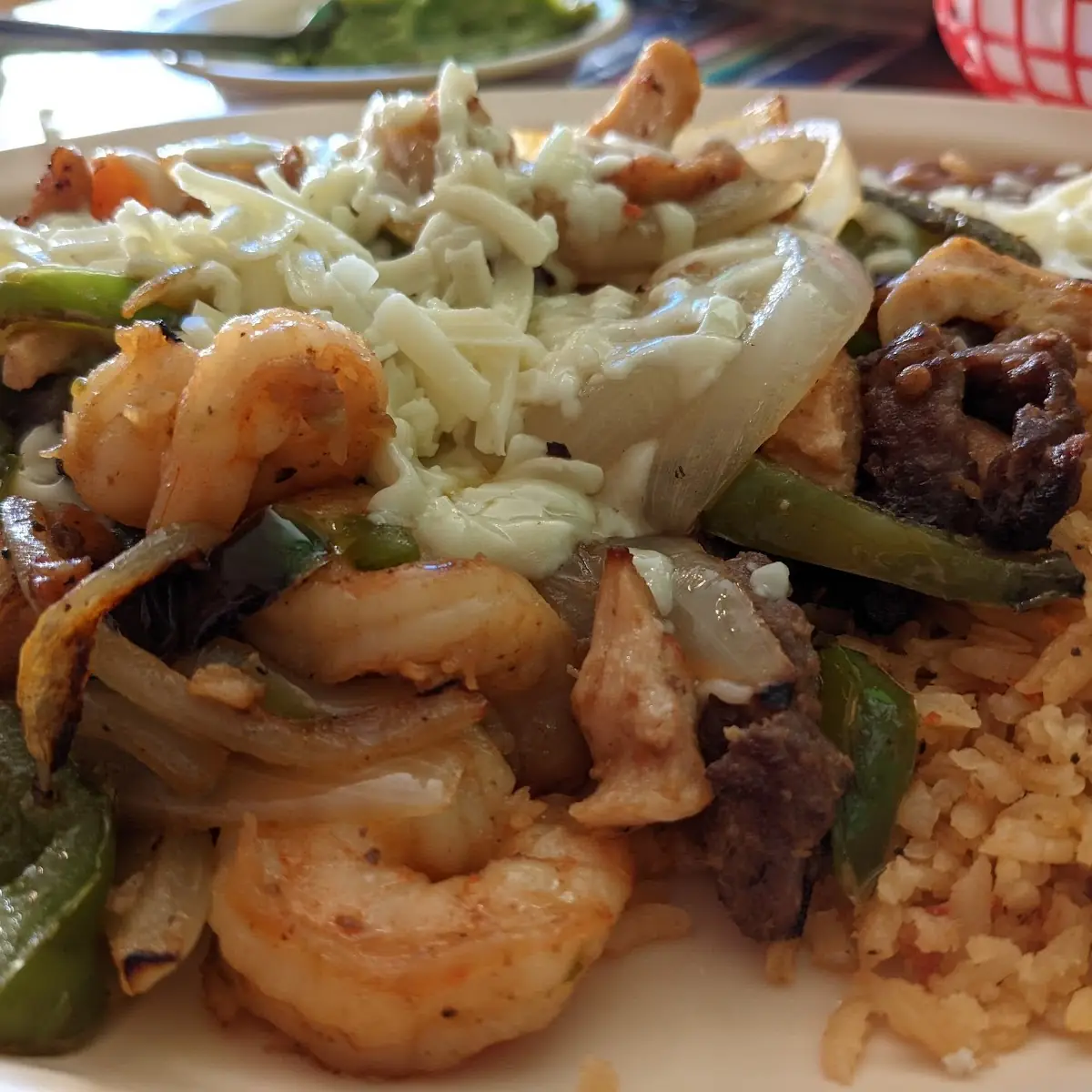 Steak Chicken and Shrimp Fajitas