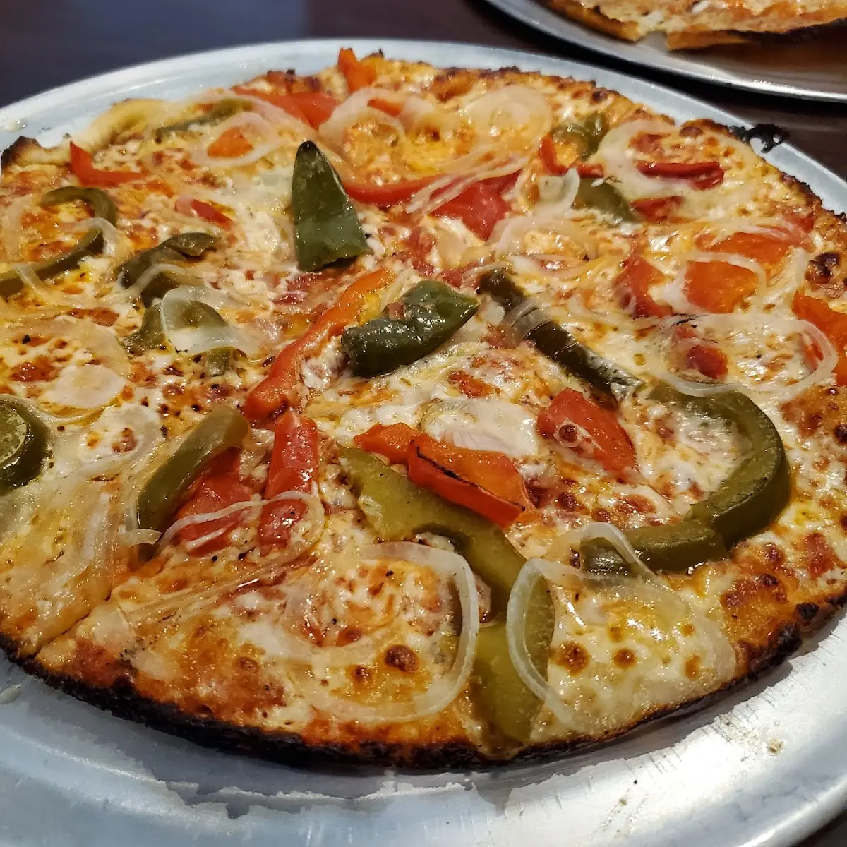 Peppers Onions and Hot Oil Pizza