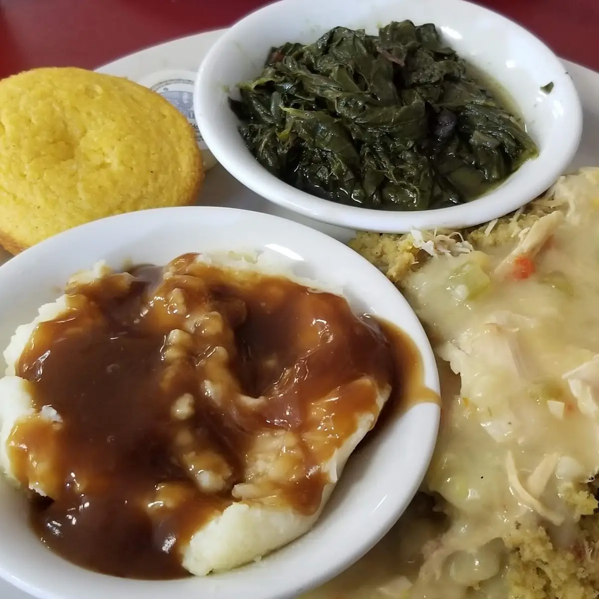 Chicken and Dressing with Turnip Greens Mashed Potatoes and Cornbread