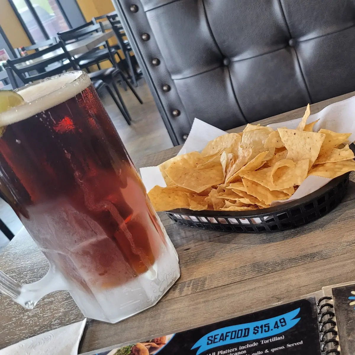 Complementary Nachos with a Dos Equis Amber