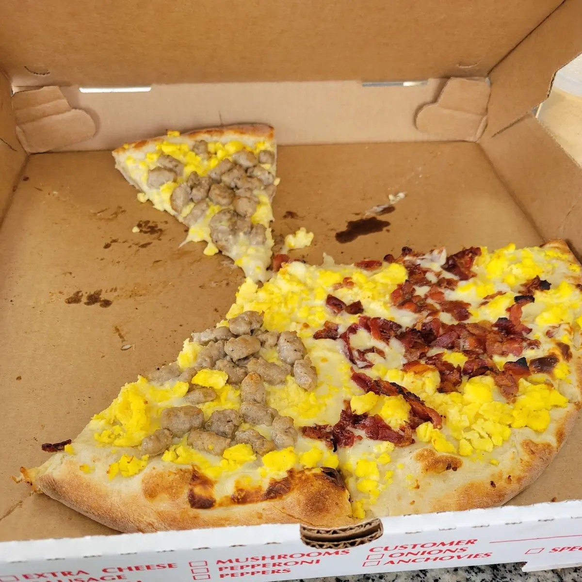 Breakfest Pizza with Egg Cheese Bacon and Sausage