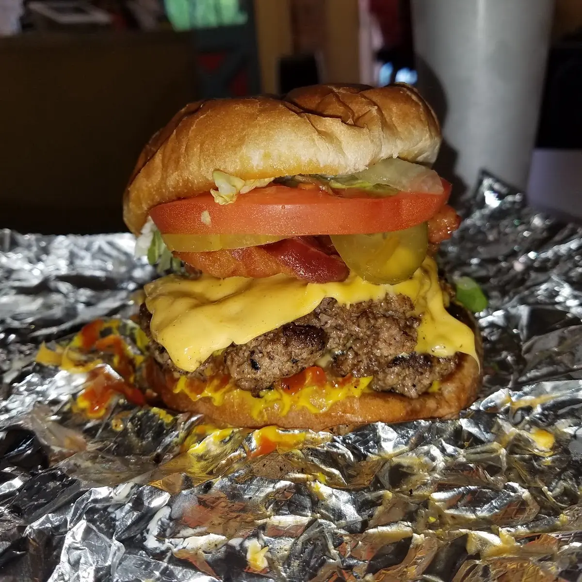 Cheeseburger with American Lettuce Tomato Onion Pickles Ketchup Mayo and a Toasted Bun
