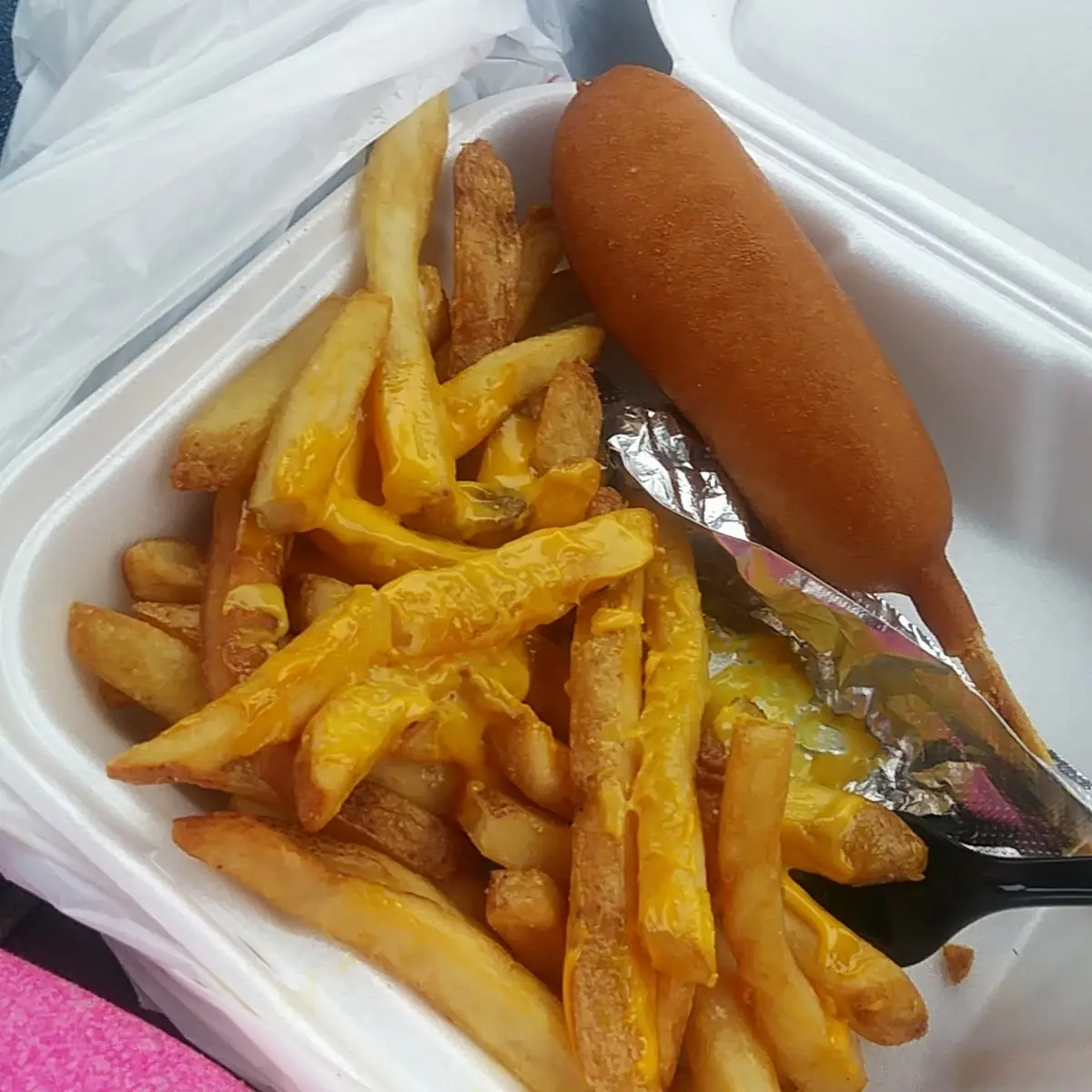Two Corn Dogs with Cheese Fries