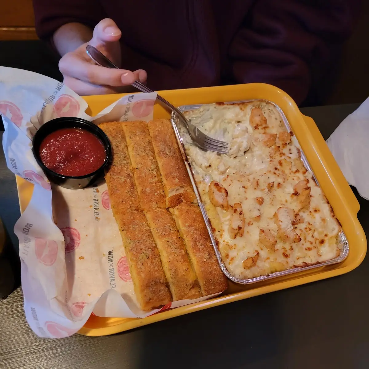 Chicken Alfredo Dish with Bread Sticks