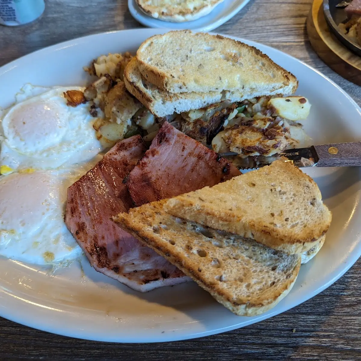 Ywo Eggs Ham Hash Browns and Rye Toast