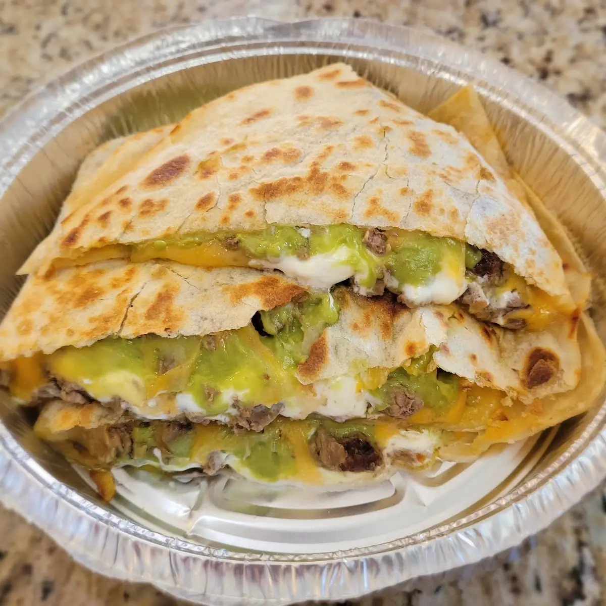 Carne Asada Quesadilla with Sour Cream and Guacamole