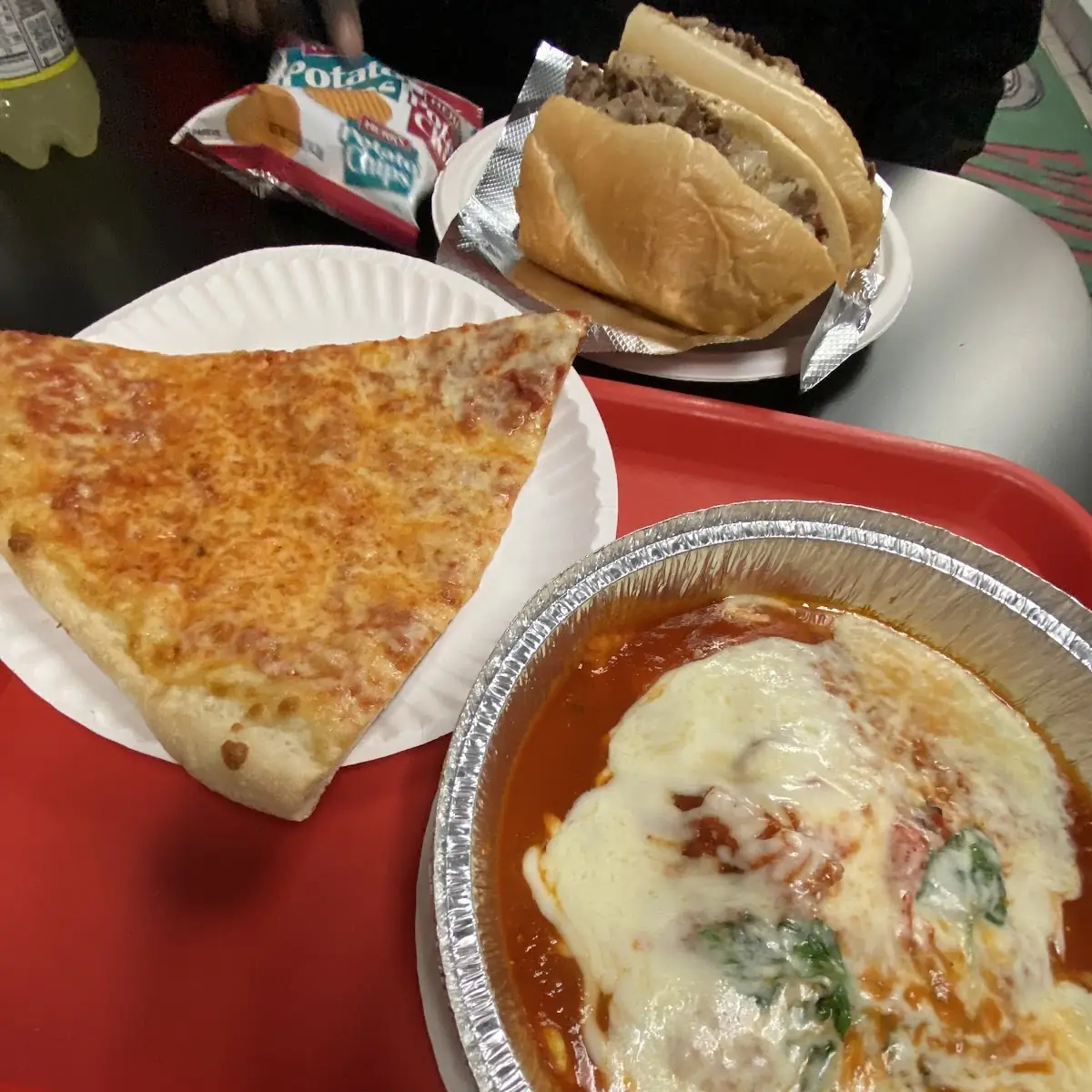 Cheese Pizza Ravioli Cheesesteak and Soda