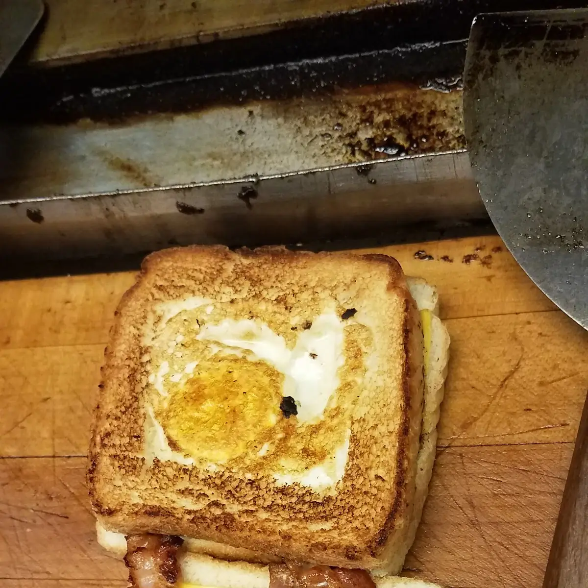 Bacon Sausage Egg in a Basket