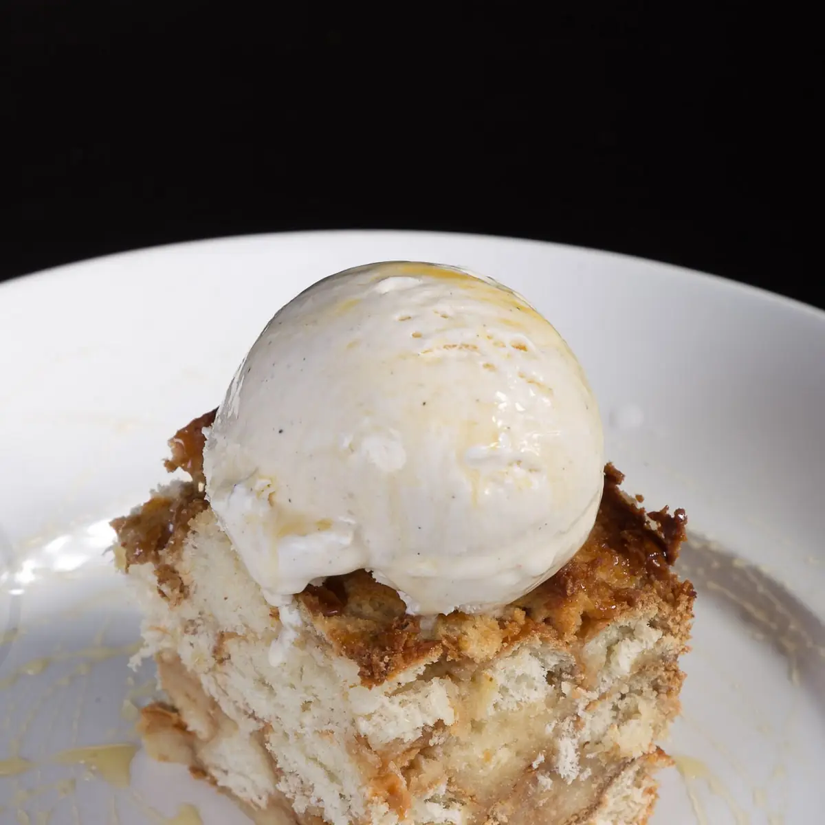 White Chocolate Bread Pudding with Bourbon Glaze and Vanilla Bean Ice Cream