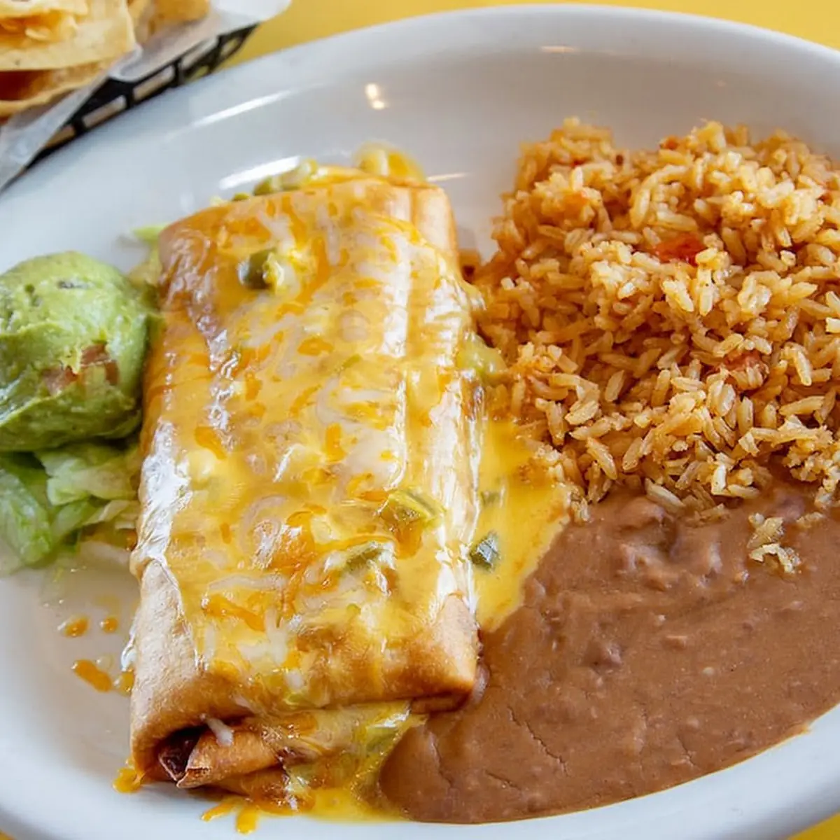 Cheese Enchiladas Tamale Refried Beans and Spanish Rice