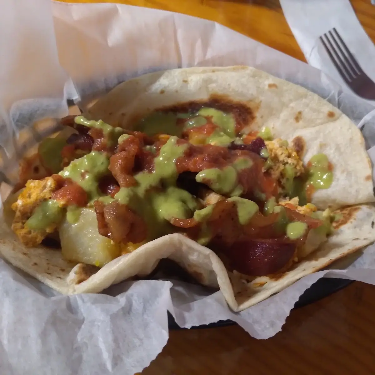 Breakfast Tacos w Potatoes Eggs Rice Refried Beans Chorizo & Bacon