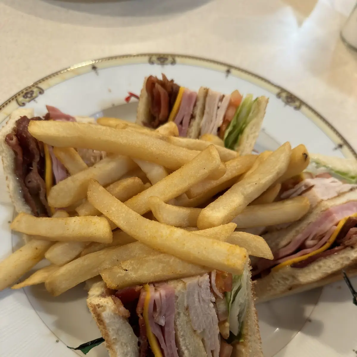 Club Sandwich with Ham Bacon Turkey American Cheese Lettuce Tomato and Mayonnaise