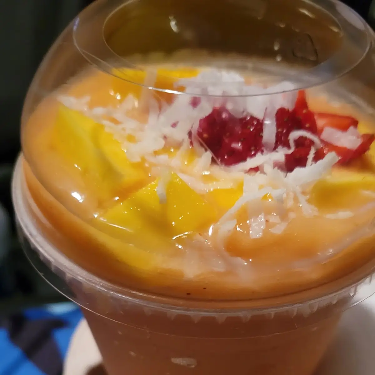 Mango Coolada with Vanilla Ice Cream Topped with Coconut Shavings and Strawberry