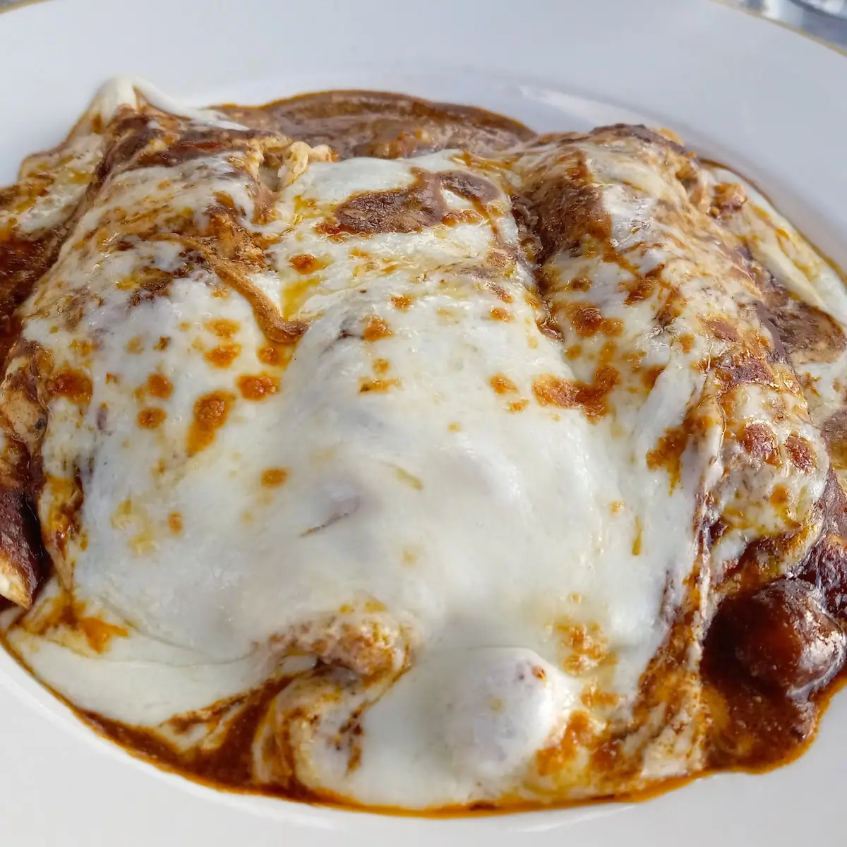 Enchiladas Mole Poblano- Recipe Unlike Other Mole Sauces That Traditionally Use Radishes