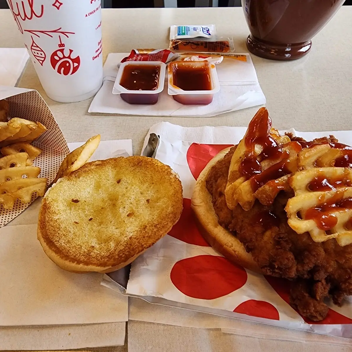 1 Chicken Sandwich with Waffle Fries BBQ Sauce and Texas Pete on Top